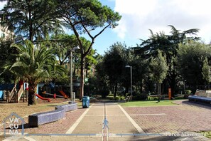 Stroll through the park and enjoy the playground with a slide and climbing structure.