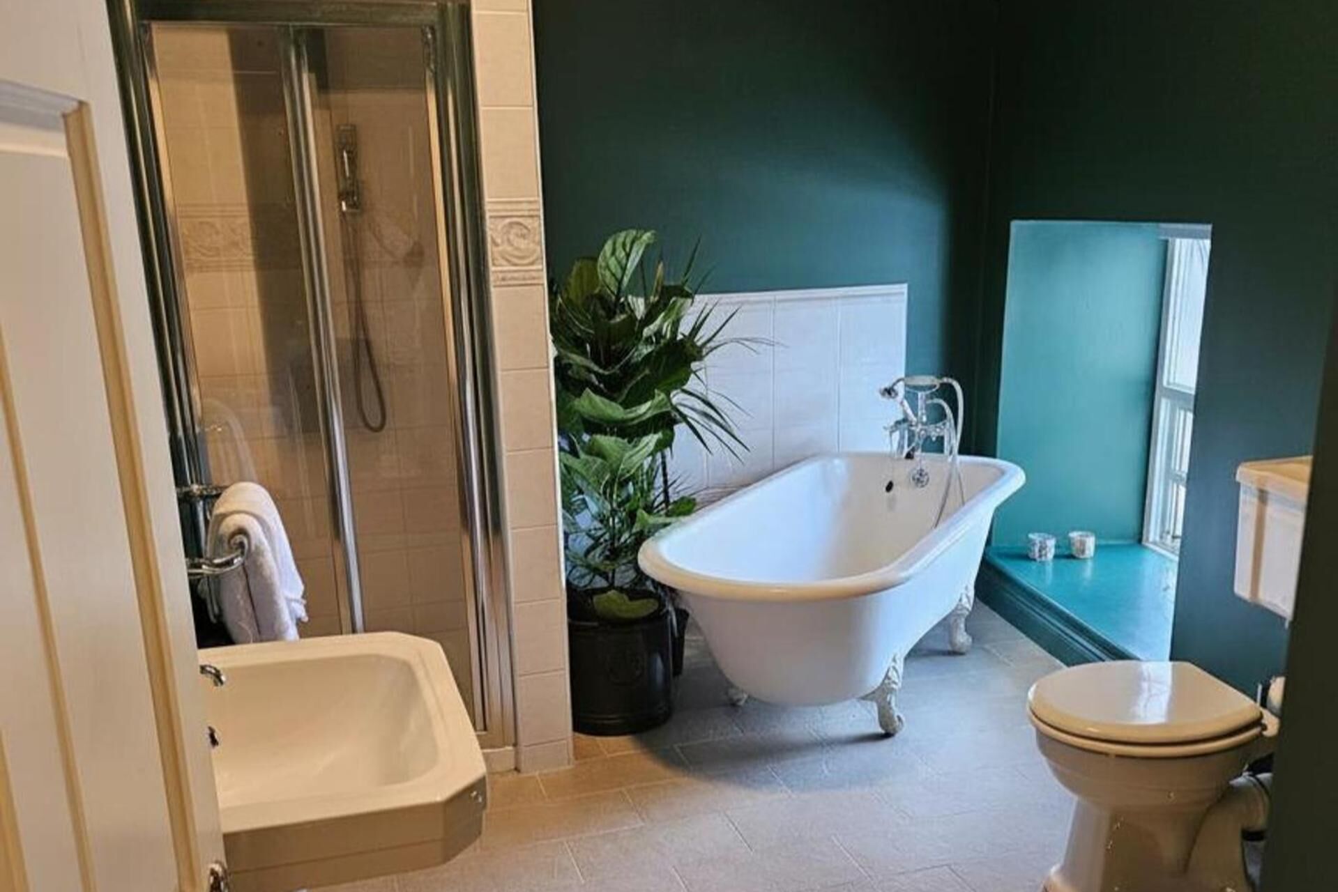 Separate bathtub and shower, deep-soaking bathtub, hair dryer, towels