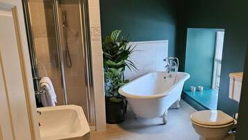 Separate bathtub and shower, deep-soaking bathtub, hair dryer, towels