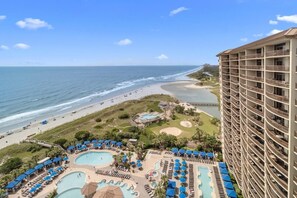 A resort with multiple swimming pools, a beach, and a high-rise building. - Shoreline Splendor Sanctuary: 2BR Condo with WiFi (North Myrtle Beach)
