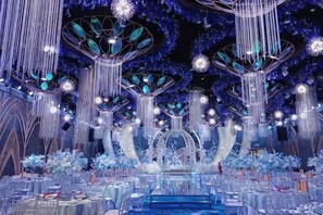 A grand hall with tiered seating, chandeliers, and a central stage. - Jiangyou Hotel (Jiangyou)