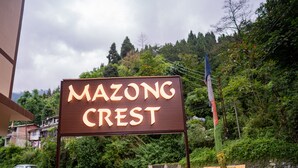 A sign for 'Mazong Crest' with a mountainous backdrop. - Mazong Crest (Gangtok)