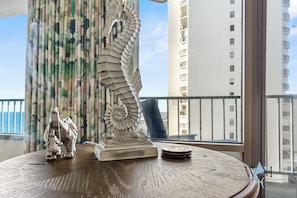 Enjoy a panoramic view of the city from this room's large window.