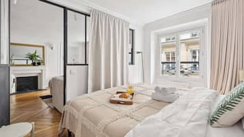 1 bedroom, desk, iron/ironing board, travel crib