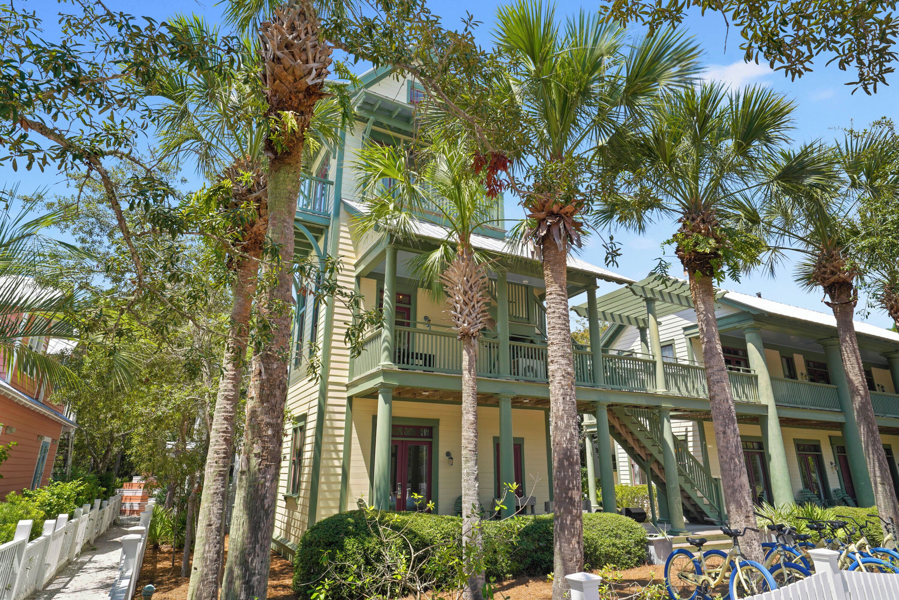 A two-story building with a balcony and a staircase.