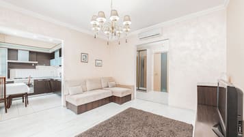 Apartment, City View | Living area | 39-inch LCD TV with cable channels