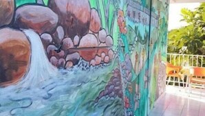 A mural with a waterfall and tropical scenery. - Villa Ludivine 2 (Sainte-Anne, Guadeloupe)