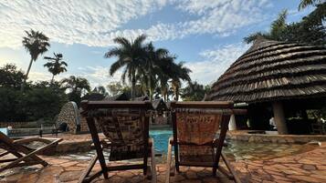 Outdoor pool, open 10:00 AM to 7:00 PM, pool loungers