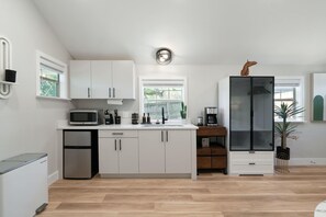 Fridge, microwave, coffee/tea maker, toaster