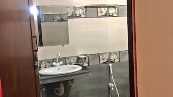 Shower, towels, soap, toilet paper