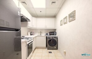 Comfort Apartment, City View | Private kitchenette | Fridge, microwave, stovetop, dishwasher