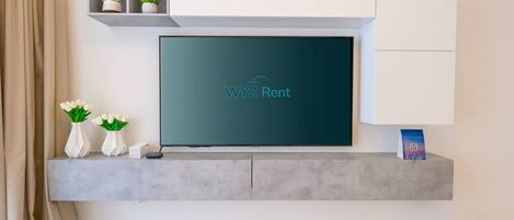 Comfort Apartment, City View | Living area | 50-cm Smart TV with cable channels, Netflix, streaming services