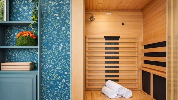 A sauna with wooden benches and a small shelf with a plant and a box. - Mad Hatter 2BR, Sauna | Price Negotiable, Send DM (Charlotte)