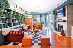 TV, fireplace, offices - Mad Hatter | Free Parking, Sauna, and Balcony (Charlotte)