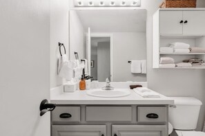 Shower, hair dryer, towels, shampoo