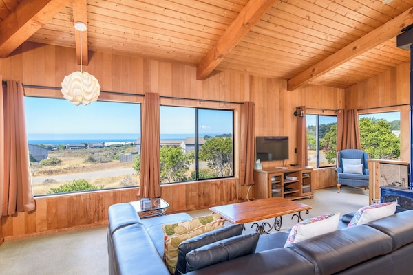 Cozy and spacious living area with TV