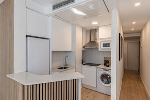 Fridge, microwave, stovetop, coffee/tea maker