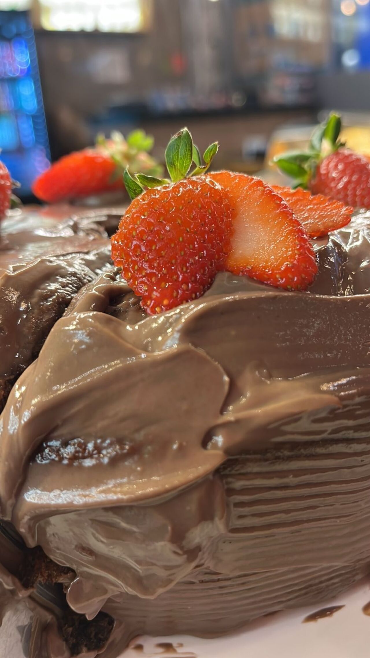 A chocolate cake with strawberries on top.