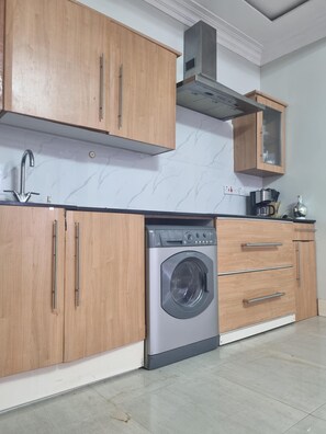 Apartment | Private kitchen | Fridge, microwave, oven, stovetop - Sunrise Haven in Dar es Salaam (Dar es Salaam)