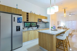 Fridge, microwave, stovetop, coffee/tea maker
