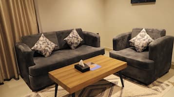 Junior Suite | 1 bedroom, in-room safe, blackout curtains, iron/ironing board