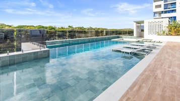 Outdoor pool, pool umbrellas, sun loungers