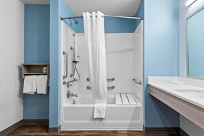 Combined shower/tub, hydromassage showerhead, hair dryer, towels - WoodSpring Suites St Peters-OFallon (St. Peters)