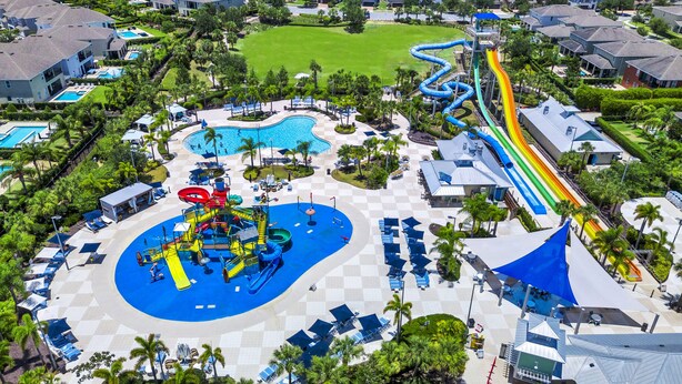 An aerial view of a resort with a water park, swimming pools, and a golf course. - Inviting Home near Disney with Waterpark & Resort Access at Encore Resort -. (Kissimmee)