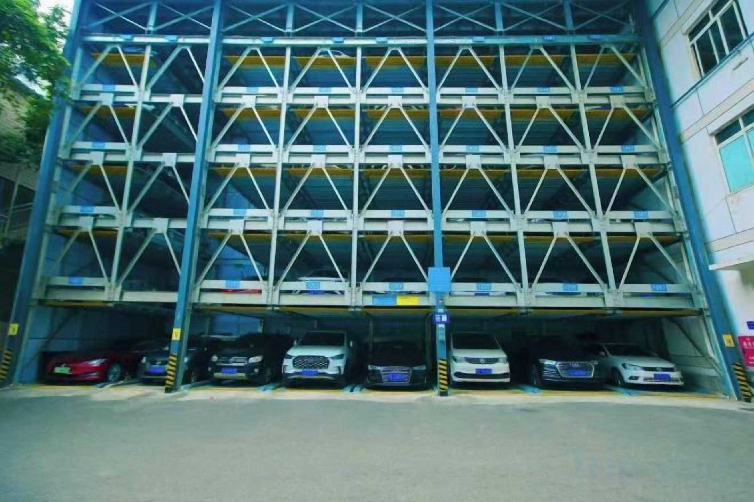 A multi-level parking garage with several cars parked.
