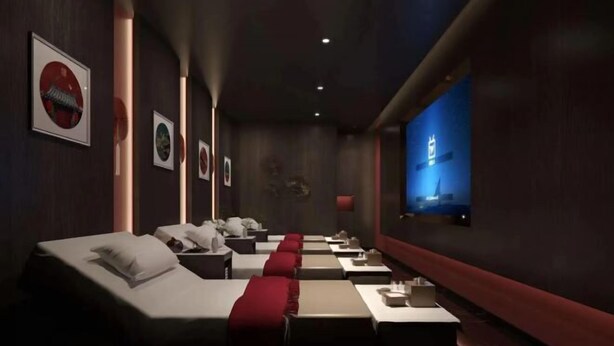 A hotel room with a long row of beds, a TV screen, and framed pictures on the wall. - Wanli Hotel (Chengdu Head Office) (Chengdu)