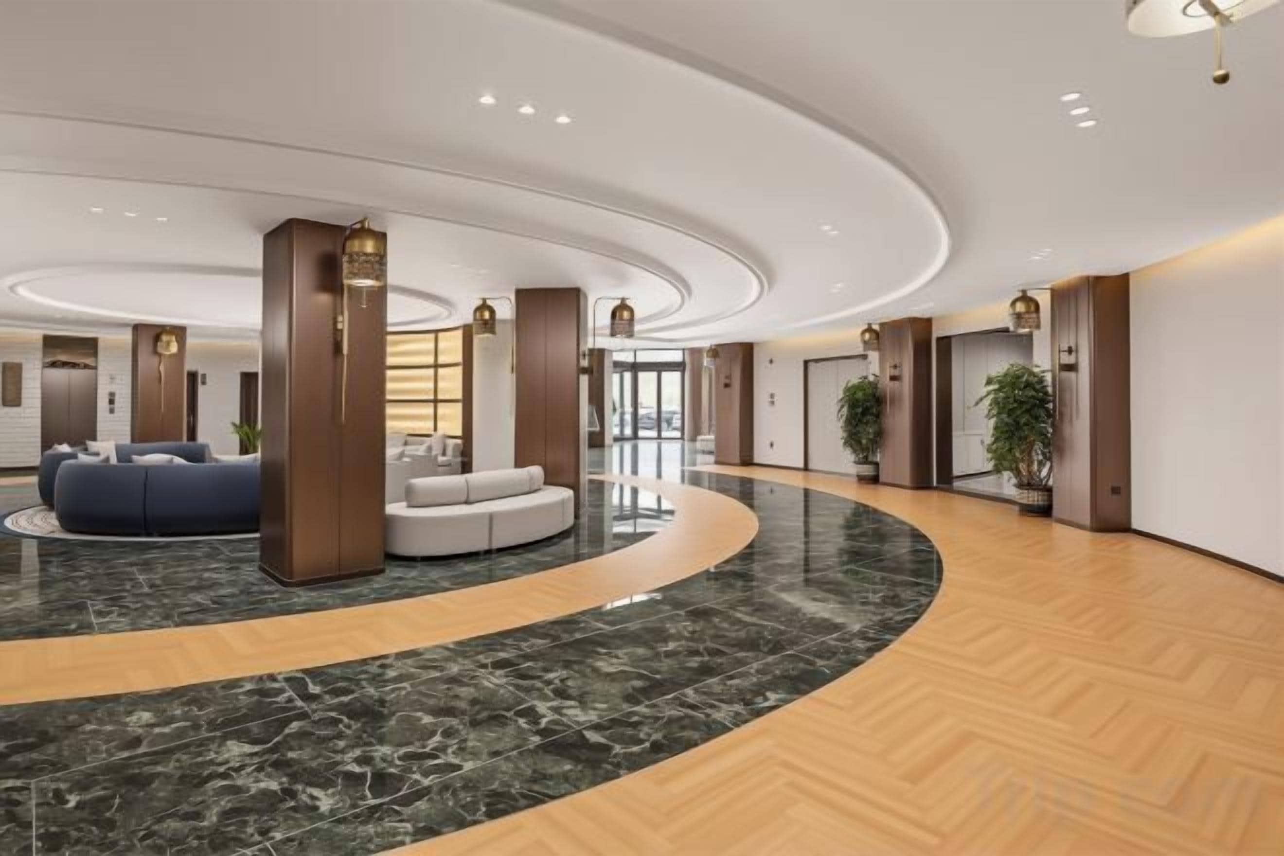 A spacious lobby with a curved marble floor, a seating area with sofas, and a reception desk.