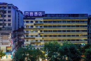 A multi-story hotel with a prominent signage, surrounded by other buildings and trees. - Fanke Hotel (Zunyi Club Site Zhonghua Road) (Zunyi)