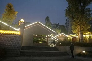 A building with a brick facade and a staircase leading to a gated entrance. - Fanke Hotel (Zunyi Club Site Zhonghua Road) (Zunyi)