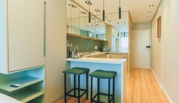 Fridge, microwave, stovetop, coffee/tea maker