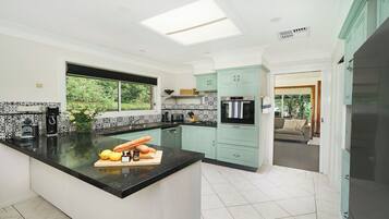 Coffee/tea maker, fridge, microwave, oven