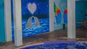 A room with a mural of a night sky, a heart, and wings. - Pacific Paradise (Champerico)