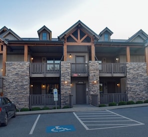 Two-story building with a central entrance and balconies on each floor.