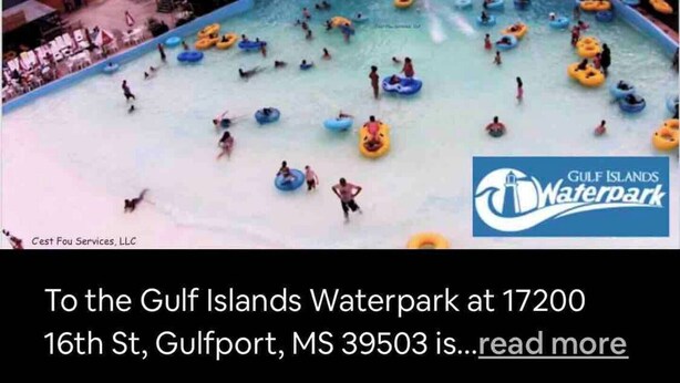 A water park with multiple water slides and people in water tubes. - Sunset Beach Hideaway (Gulfport)