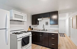 Microwave, oven, coffee/tea maker, cookware/dishes/utensils