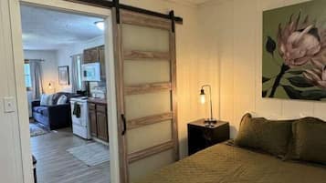 1 bedroom, desk, iron/ironing board, travel crib