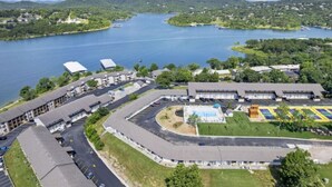 A large building with multiple parking lots and a swimming pool. - Captain`s Quarters at Kimberling Crossing (Kimberling City)