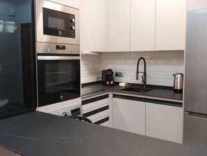 Fridge, microwave, coffee/tea maker, toaster