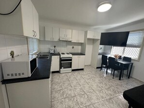 Fridge, microwave, stovetop, cookware/dishes/utensils