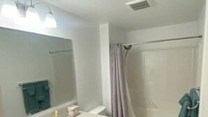 A bathroom with a sink, toilet, and shower. - Nightly or short term rental in Medford. (Medford)