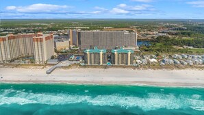 A coastal hotel with multiple high-rise buildings, a beachfront, and a view of the ocean. - Palm Tree Paradise – Free Beach Chairs & Umbrella, 5 Pools, Beach Access | Laketown Wharf 1531 (Panama City Beach)