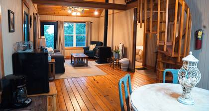 Cozy 2-bedroom cottage with loft, AC, and WiFi on peaceful 295-acre property