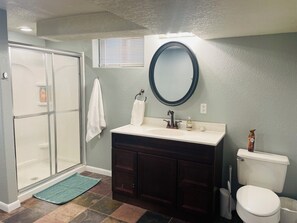 Shower, hair dryer, towels, soap