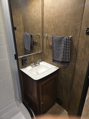 Shower, towels, soap, toilet paper