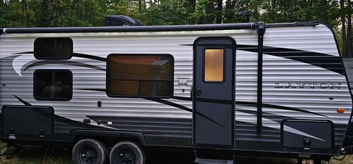 A well-maintained, cozy camper in a secluded location near state land