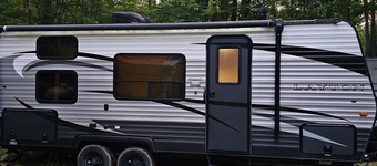 A well-maintained, cozy camper  in a secluded location near state land